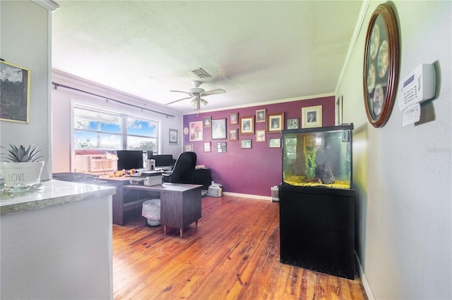 4430 1st St NW, Lakeland, FL 33810 - home office with light wood-type flooring, a ceiling fan, and crown molding
