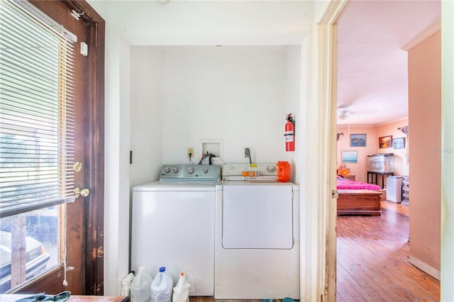 4430 1st St NW, Lakeland, FL 33810 - washroom featuring independent washer and dryer and wood finished floors