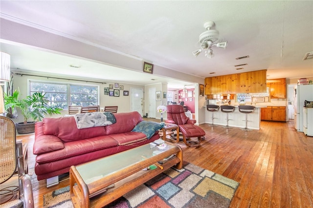 4430 1st St NW, Lakeland, FL 33810 - living area with a ceiling fan and light wood-style flooring