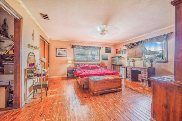 4430 1st St NW, Lakeland, FL 33810 - bedroom featuring crown molding, wood-type flooring, and multiple windows
