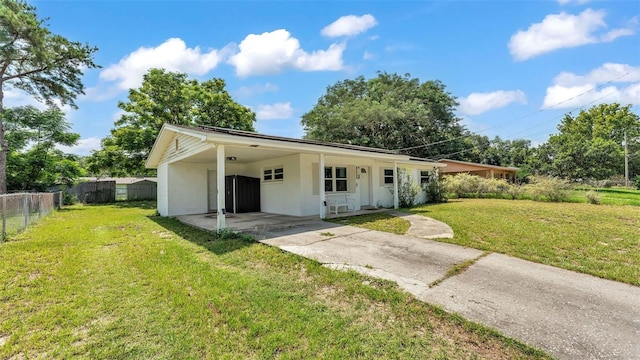 815 Everett St, Lake Alfred, FL 33850 - ranch-style house featuring driveway, stucco siding, and an attached carport
