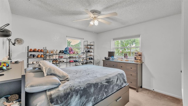 815 Everett St, Lake Alfred, FL 33850 - bedroom featuring light carpet, a textured ceiling, and a ceiling fan