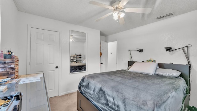 815 Everett St, Lake Alfred, FL 33850 - bedroom featuring light carpet, a textured ceiling, and ceiling fan