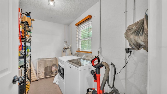 815 Everett St, Lake Alfred, FL 33850 - laundry area featuring washer and clothes dryer, a textured ceiling, and carpet flooring