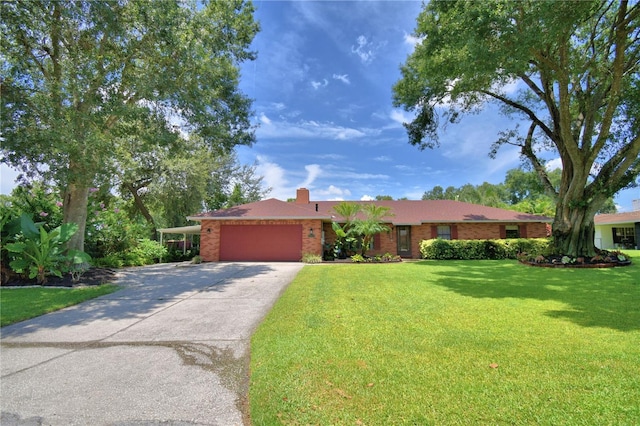 2814 Grapefruit Dr, Auburndale, FL 33823 - single story home featuring a garage, a front lawn, driveway, brick siding, and a chimney