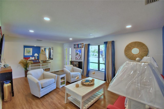 2814 Grapefruit Dr, Auburndale, FL 33823 - living area with wood finished floors and recessed lighting