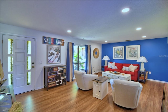 2814 Grapefruit Dr, Auburndale, FL 33823 - living room with light wood-style flooring and recessed lighting