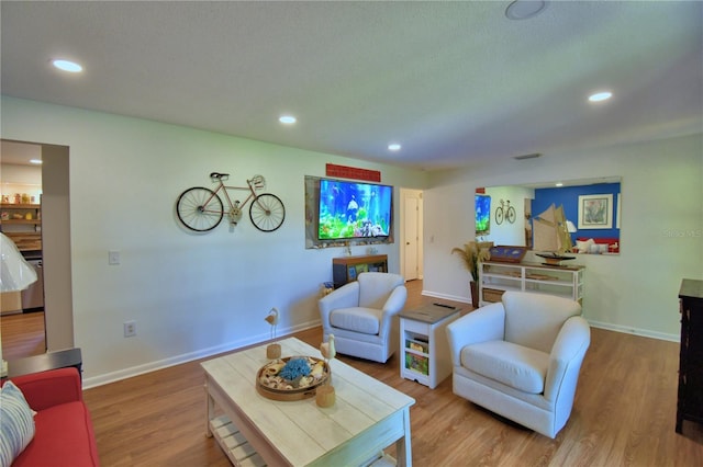 2814 Grapefruit Dr, Auburndale, FL 33823 - living area featuring wood finished floors and recessed lighting