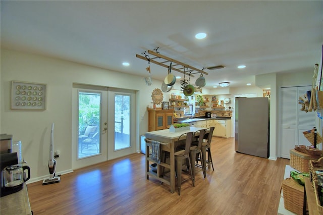 2814 Grapefruit Dr, Auburndale, FL 33823 - dining room featuring french doors, light wood-style flooring, and recessed lighting