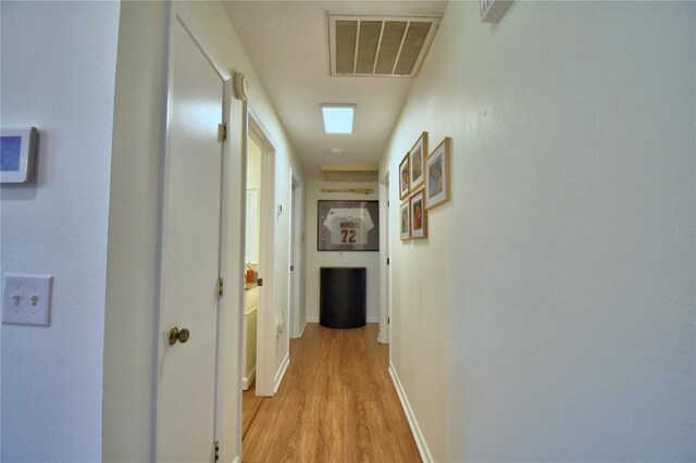 2814 Grapefruit Dr, Auburndale, FL 33823 - corridor with light wood-style flooring and baseboards