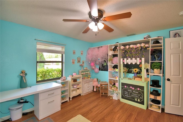 2814 Grapefruit Dr, Auburndale, FL 33823 - office with ceiling fan, wood finished floors, and a textured ceiling