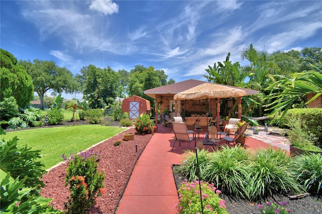 2814 Grapefruit Dr, Auburndale, FL 33823 - view of grassy yard featuring a shed and a patio area