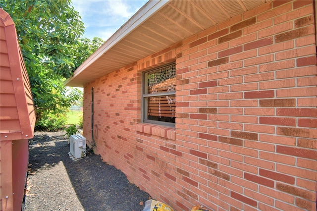 2814 Grapefruit Dr, Auburndale, FL 33823 - view of property exterior featuring an ac unit and brick siding