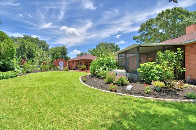 2814 Grapefruit Dr, Auburndale, FL 33823 - view of grassy yard featuring a sunroom and a storage unit