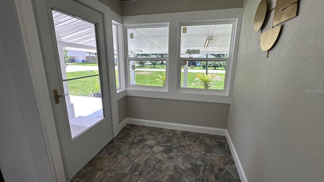 713 4th St NE, Fort Meade, FL 33841 - doorway featuring healthy amount of natural light and stone finish flooring