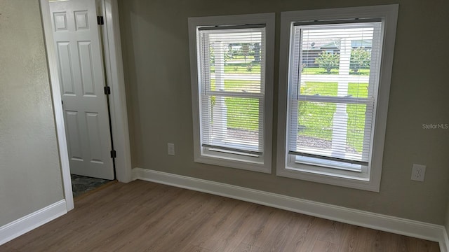 713 4th St NE, Fort Meade, FL 33841 - unfurnished room with wood finished floors and baseboards