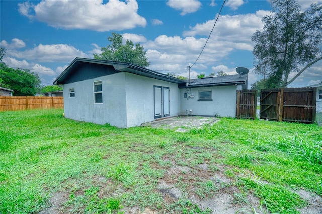 415 Boger Blvd N, Lakeland, FL 33803 - rear view of house featuring stucco siding
