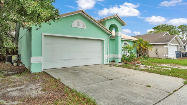912 Whisper Lake Dr, Winter Haven, FL 33880 - view of front of home with a garage, stucco siding, and concrete driveway