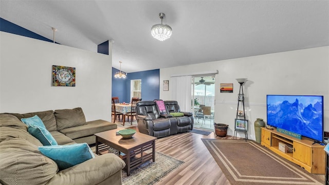 912 Whisper Lake Dr, Winter Haven, FL 33880 - living area featuring a chandelier, lofted ceiling, and wood finished floors