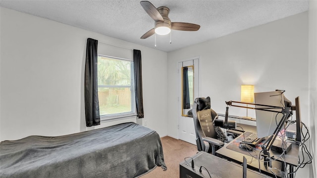 912 Whisper Lake Dr, Winter Haven, FL 33880 - bedroom with carpet floors, an office area, ceiling fan, and a textured ceiling