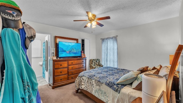 912 Whisper Lake Dr, Winter Haven, FL 33880 - bedroom with carpet floors, a ceiling fan, and a textured ceiling