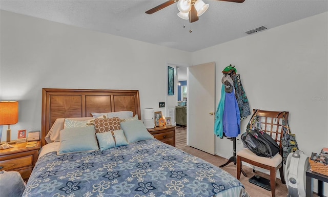 912 Whisper Lake Dr, Winter Haven, FL 33880 - bedroom featuring light colored carpet, a ceiling fan, and a textured ceiling