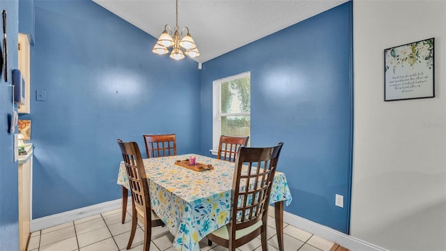 912 Whisper Lake Dr, Winter Haven, FL 33880 - dining area with a chandelier, vaulted ceiling, and light tile patterned floors