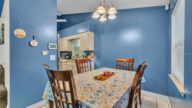 912 Whisper Lake Dr, Winter Haven, FL 33880 - dining room with a chandelier and light tile patterned floors