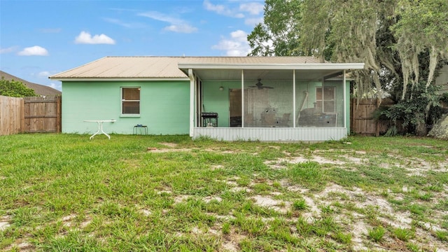 912 Whisper Lake Dr, Winter Haven, FL 33880 - rear view of house featuring a sunroom, ceiling fan, a metal roof, and concrete block siding