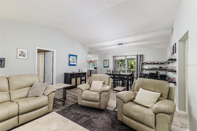 2056 Broken Arrow Trl N, Lakeland, FL 33813 - living area with wood finished floors and vaulted ceiling