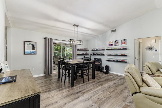 2056 Broken Arrow Trl N, Lakeland, FL 33813 - dining area featuring light wood-style flooring and high vaulted ceiling