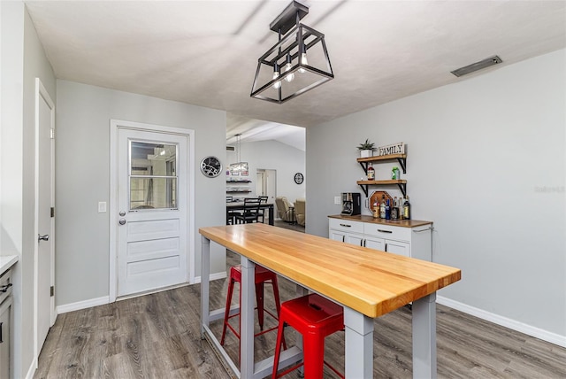 2056 Broken Arrow Trl N, Lakeland, FL 33813 - dining room with wood finished floors and baseboards