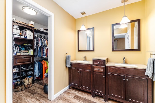 2056 Broken Arrow Trl N, Lakeland, FL 33813 - full bath featuring wood finish floors, double vanity, and a spacious closet