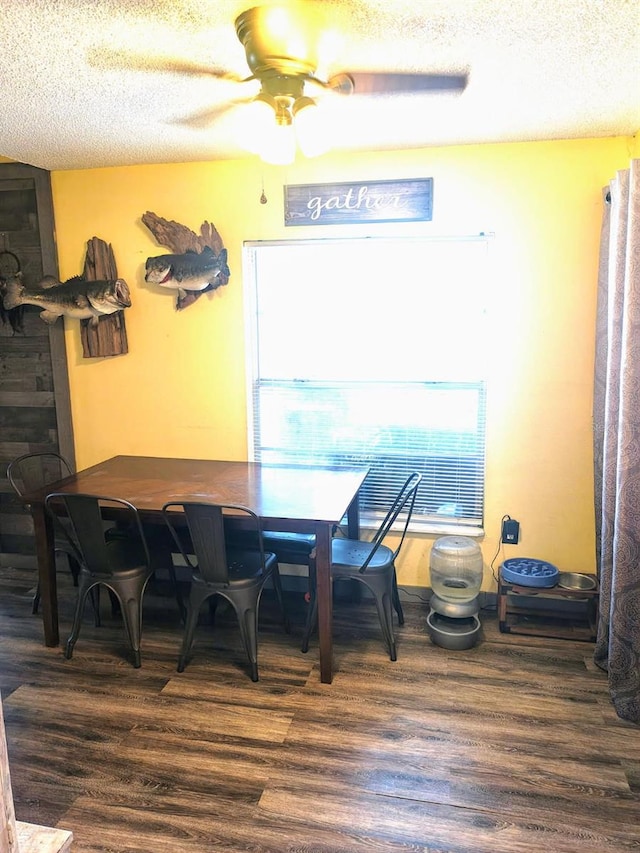 985 Whisper Lk, Winter Haven, FL 33880 - dining space featuring wood finished floors, a textured ceiling, and ceiling fan