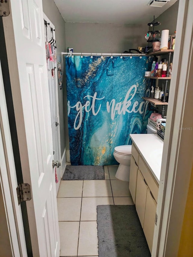 985 Whisper Lk, Winter Haven, FL 33880 - bathroom with tile patterned floors, vanity, and curtained shower