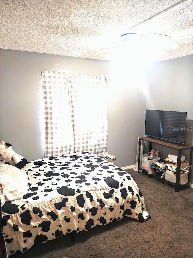 985 Whisper Lk, Winter Haven, FL 33880 - bedroom featuring carpet floors, a textured ceiling, and ceiling fan