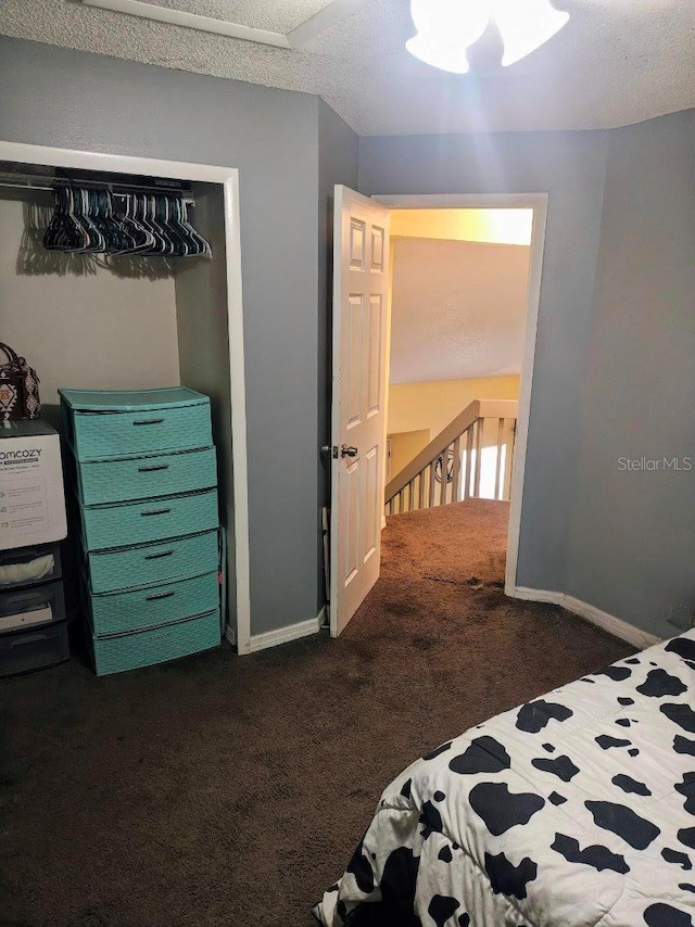 985 Whisper Lk, Winter Haven, FL 33880 - bedroom with dark carpet and baseboards