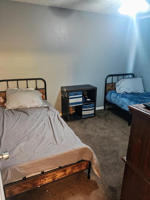 985 Whisper Lk, Winter Haven, FL 33880 - bedroom with dark colored carpet and a textured ceiling