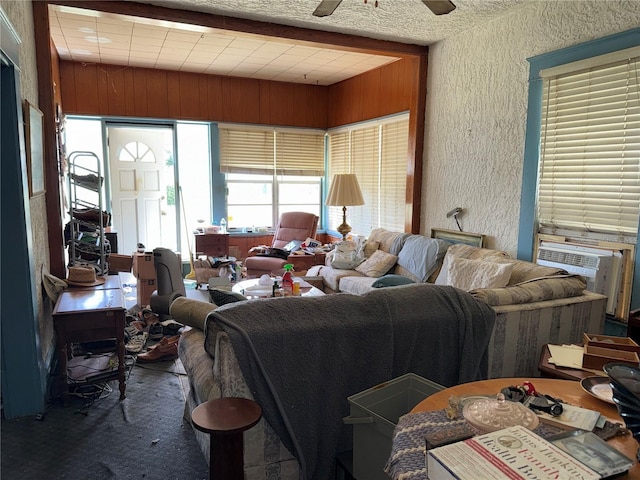 724 Ave D SW, Winter Haven, FL 33880 - carpeted living room with a textured wall, a ceiling fan, and cooling unit