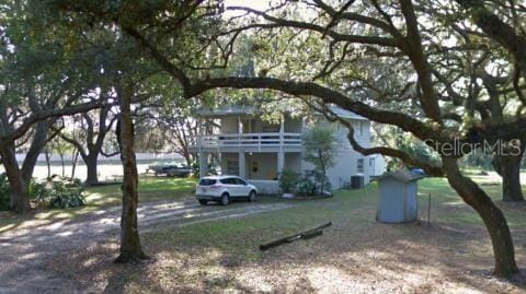 view of front of home with a balcony