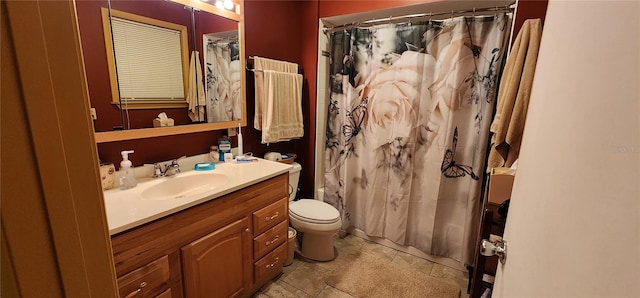 bathroom featuring vanity, toilet, tile patterned floors, and walk in shower