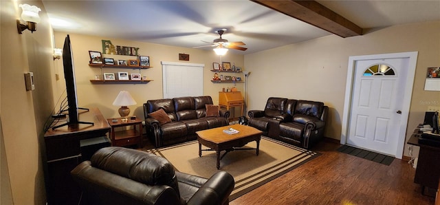 living room featuring beam ceiling, dark wood-type flooring, and ceiling fan