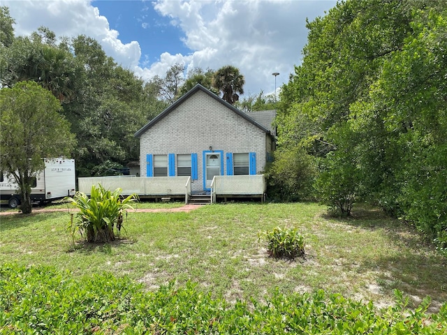 exterior space with a lawn and a deck