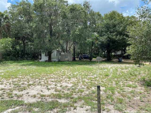 view of yard with a storage shed