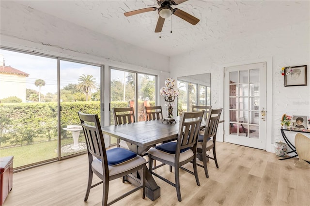 sunroom featuring ceiling fan