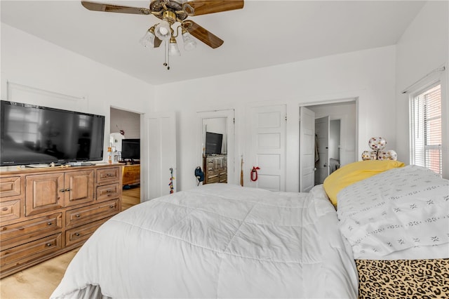 bedroom with light hardwood / wood-style floors and ceiling fan