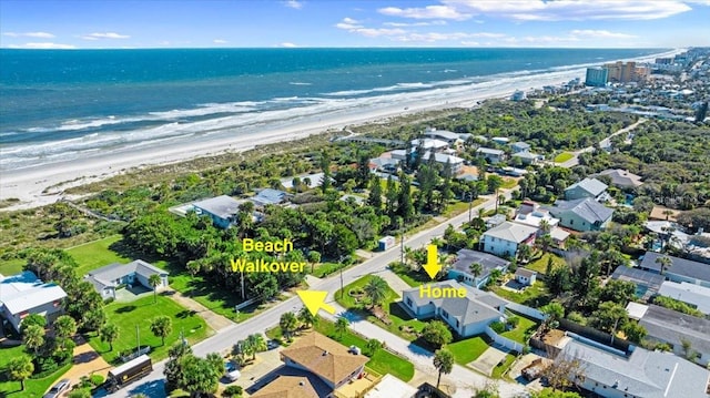 bird's eye view with a water view and a view of the beach