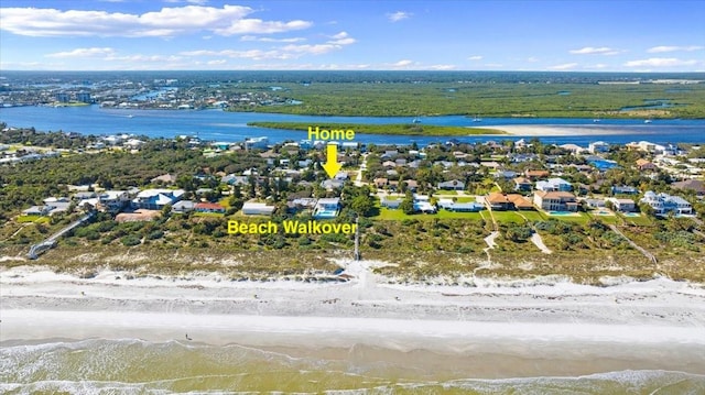 drone / aerial view with a view of the beach and a water view