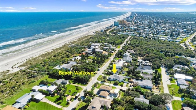 drone / aerial view with a view of the beach and a water view