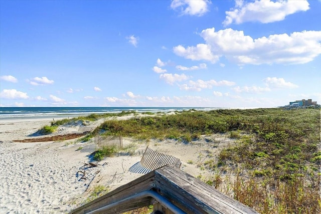 aerial view featuring a water view and a view of the beach